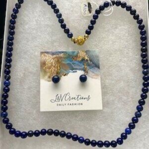 Deep blue lapis lazuli with gold findings and earrings to match